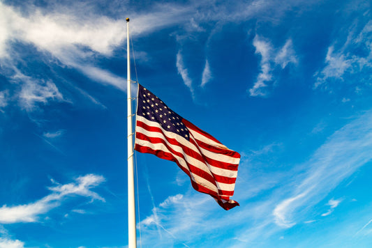 How does the Flag get ordered to be half staff?
